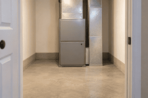 Residential furnace with a clear walkway and unobstructed space for maintenance access.
